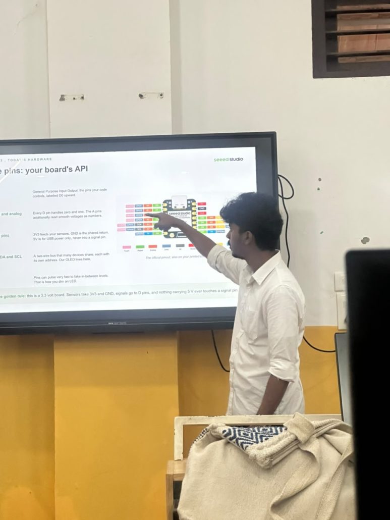 Abhinav Krishna explaining the XIAO board pinout to students at EMEA College