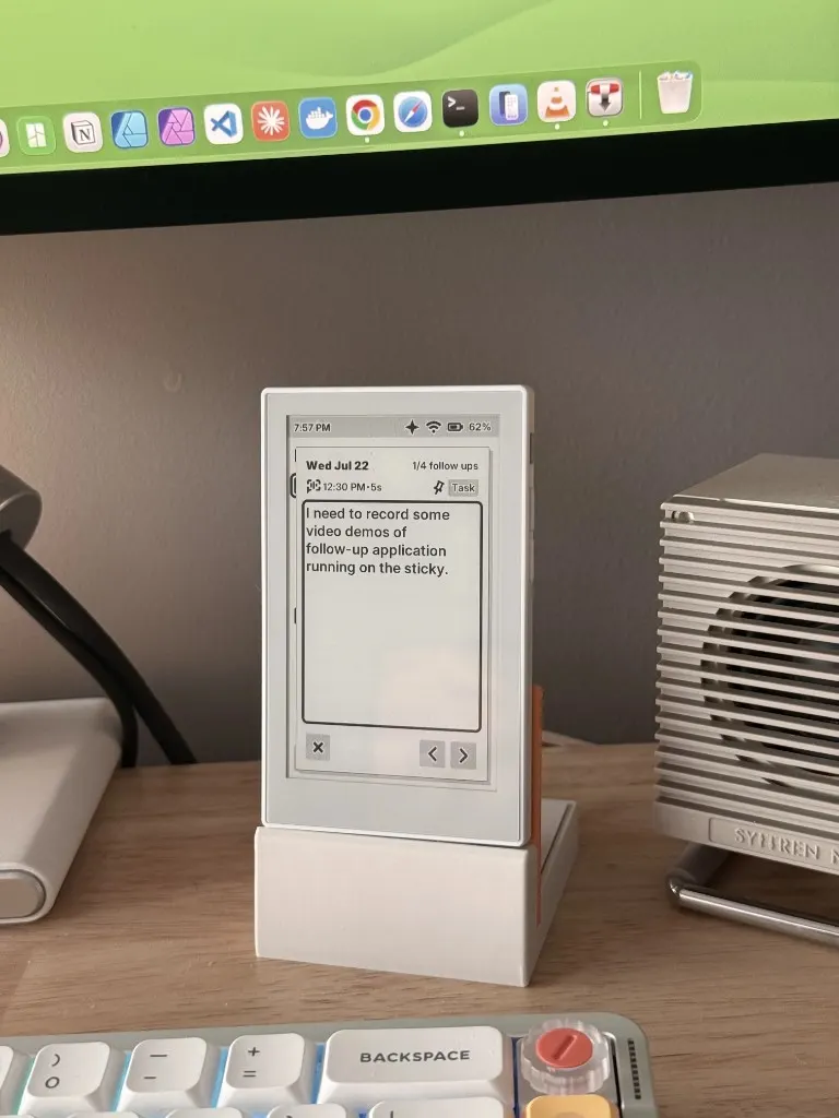 Sticky Charging Stand holding reTerminal Sticky on a desk