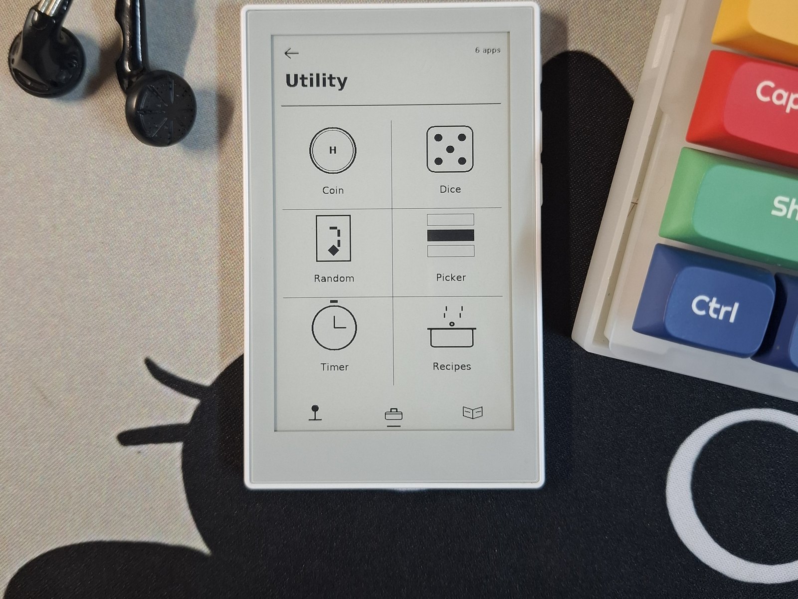 Toybox running on a reTerminal Sticky, showing the Utility drawer: coin, dice, random, picker, timer and recipes